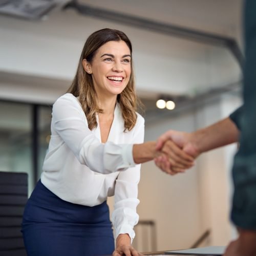 Happy,Mid,Aged,Business,Woman,Manager,Handshaking,Greeting,Client,In